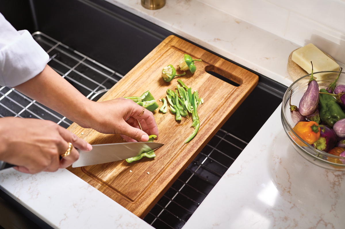 Cutting peppers on cutting board