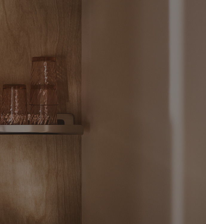 Three glasses on a shelf
