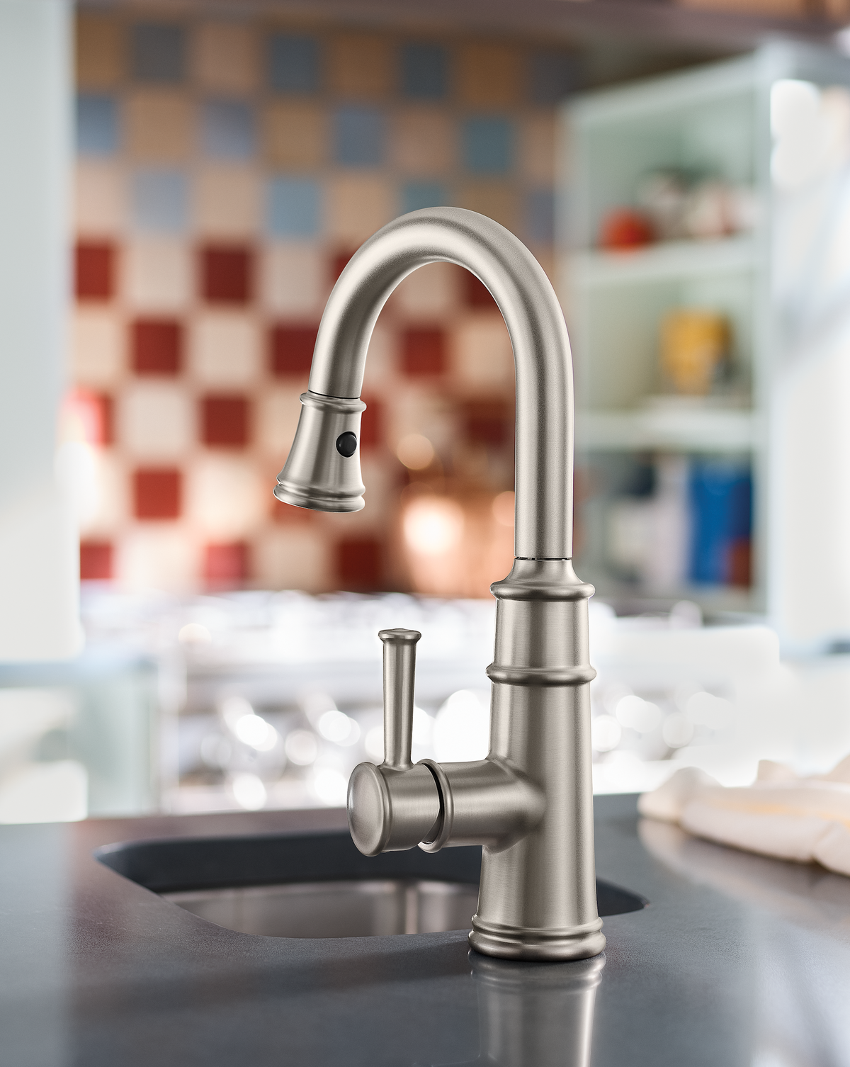 Silver Faucet with checkered tile background