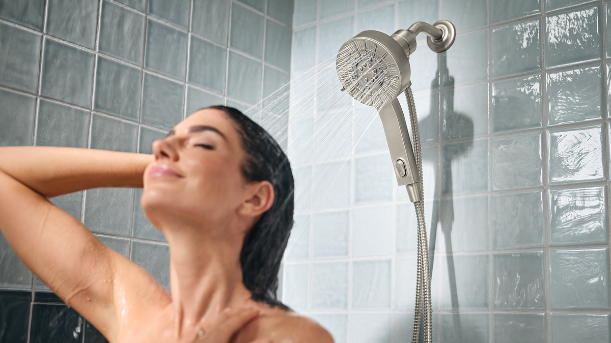 Woman washing her hair in a shower 